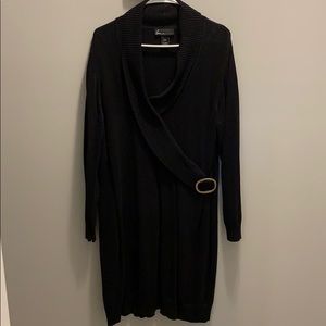 Black sweater dress with gold buckle detail